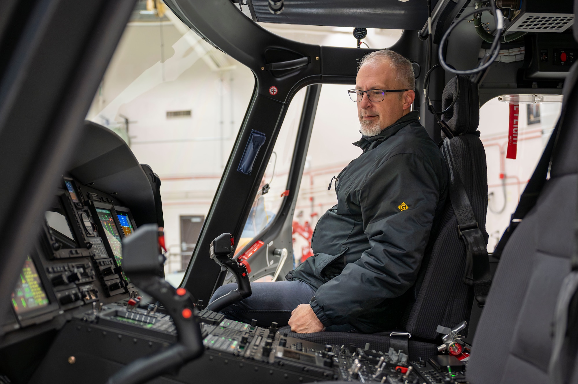 A man sitting in a helicopter.