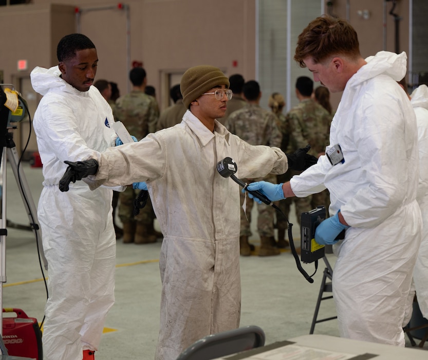 U.S. Air Force Airmen assigned to the 51st Fighter Wing simulate decontamination procedures in a nuclear environment during Radiant Falcon at Osan Air Base, Republic of Korea, Nov. 14, 2024. Radiant Falcon consisted of multiple career fields coming together to maintain airpower while keeping personnel safe. Training events like this ensure that no matter the conditions, the 51st Fighter Wing will remain ready to “Fight Tonight” and safeguard the freedom of the Indo-Pacific Theater. (U.S. Air Force photo by Senior Airman Brittany Russell)