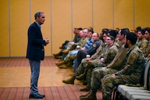 U.S. Air Force retired Col. Lee Ellis, former Vietnam War pilot and prisoner of war (POW), shares his experiences and insights with Airmen during a presentation at Misawa Air Base, Japan, Nov. 15, 2024.