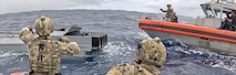 U.S. Coast Guard Cutter Munro (WMSL 755) crews interdict a vessel suspected of smuggling drugs in international waters of the Eastern Pacific Ocean, October 2024.