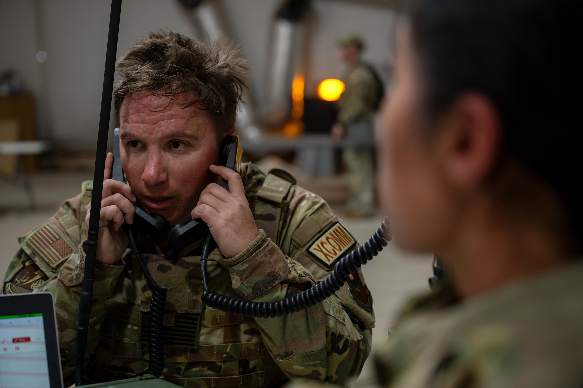 U.S. Air Force Staff Sgt. Sean Gilliland, 49th Communications Squadron noncommissioned officer in charge of radio, receives reports from various elements across the base during the 11th Air Task Force’s first field exercise at McGregor Range, New Mexico, Nov. 9, 2024. Information was channeled up from units in the field to the wing operations center, the central hub for situational awareness. (U.S. Air Force photo by Airman 1st Class Jasmyne Bridgers-Matos)