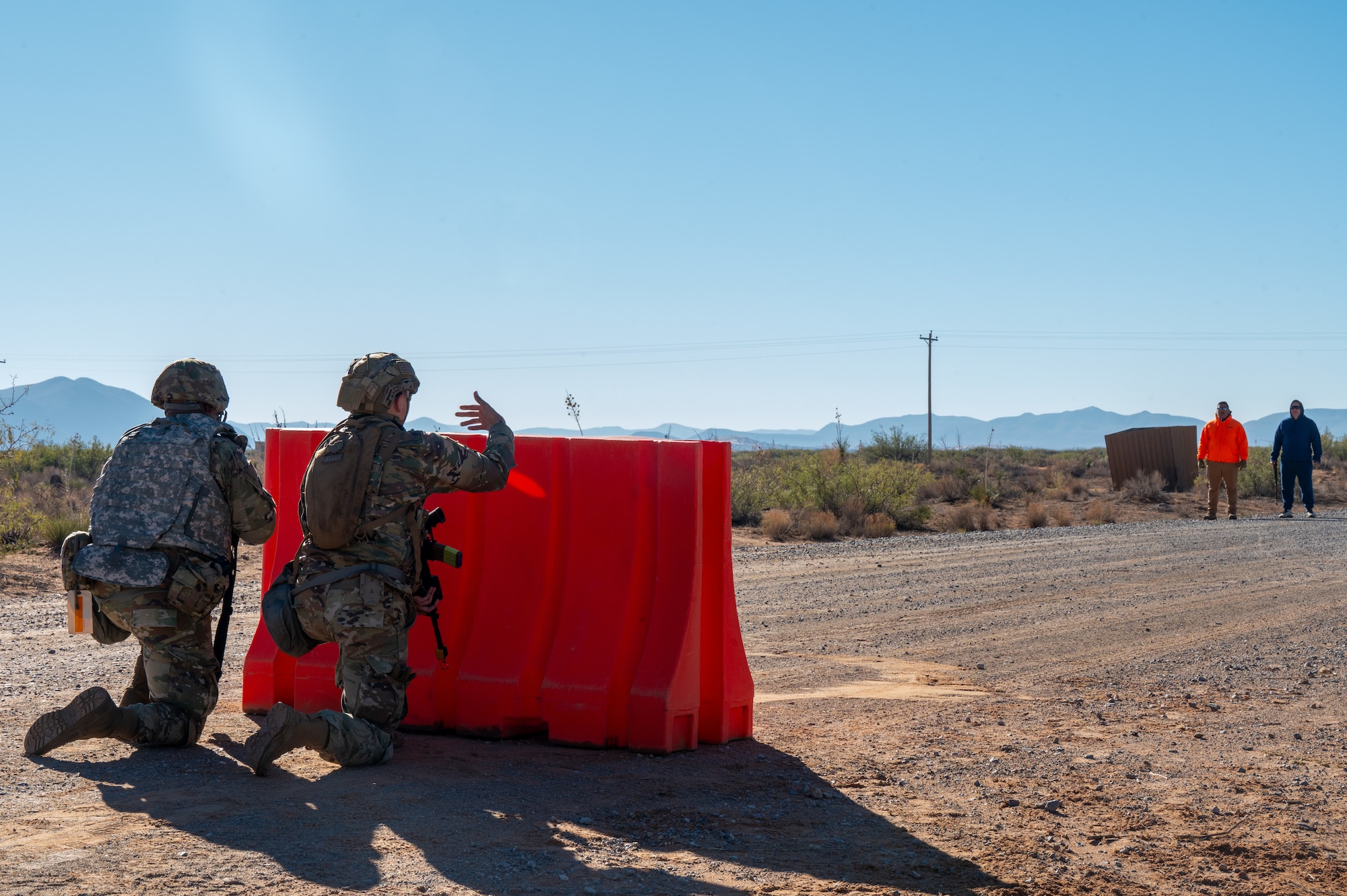 U.S. Airmen assigned to the 11th Air Task Force engage with unknown individuals at an entry control point during the 11th ATF’s first field exercise at McGregor Range, New Mexico, Nov. 9, 2024. Airmen utilized de-escalation techniques to prevent a hostile confrontation from occurring. (U.S. Air Force photo by Airman 1st Class Jasmyne Bridgers-Matos)