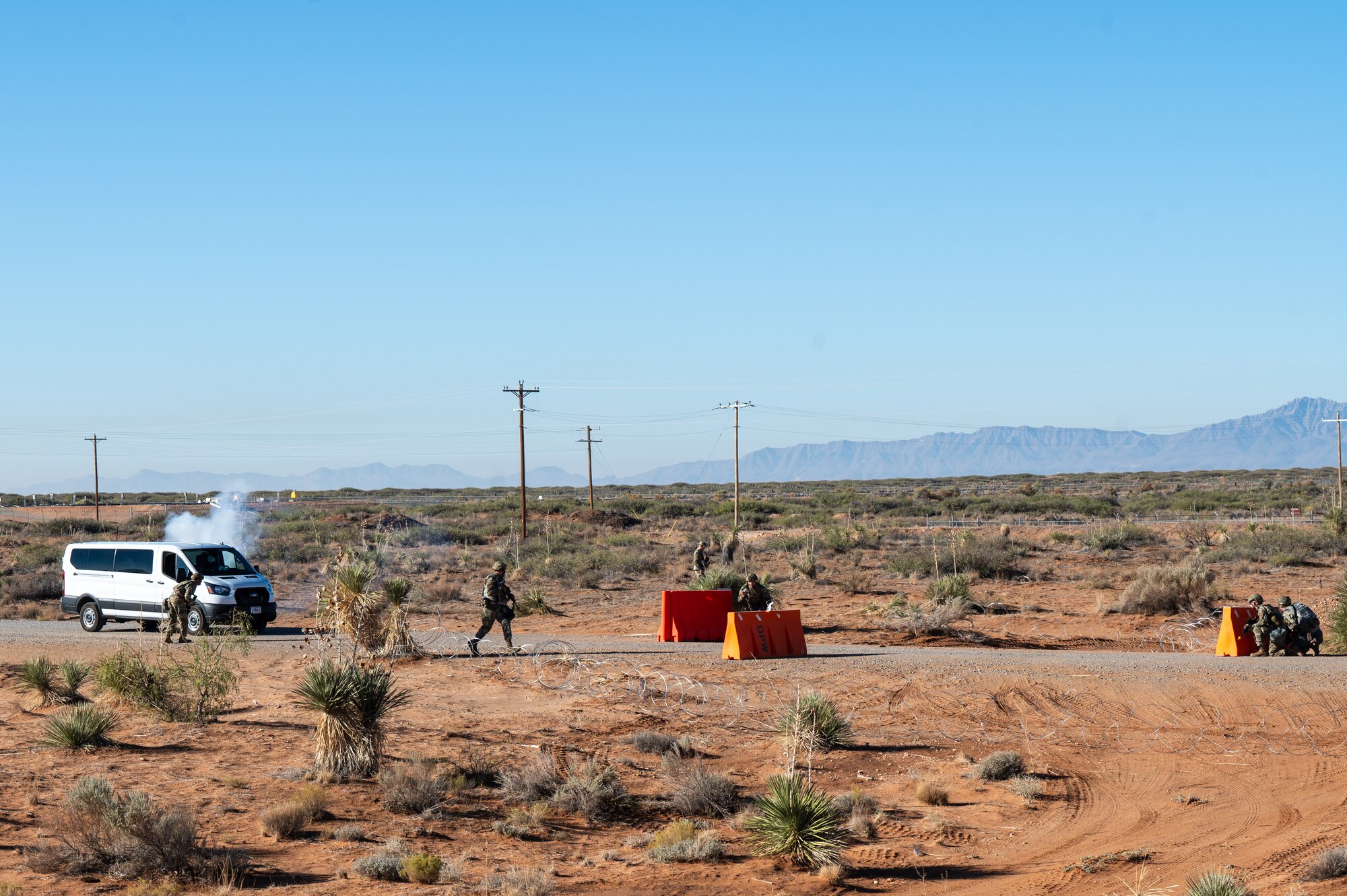 U.S. Airmen assigned to the 11th Air Task Force respond to a simulated attack at an entry control point during the 11th ATF’s first field exercise at McGregor Range, New Mexico, Nov. 9, 2024. Airmen received classroom and field training that culminated in a simulated base defense scenario. (U.S. Air Force photo by Airman 1st Class Jasmyne Bridgers-Matos)