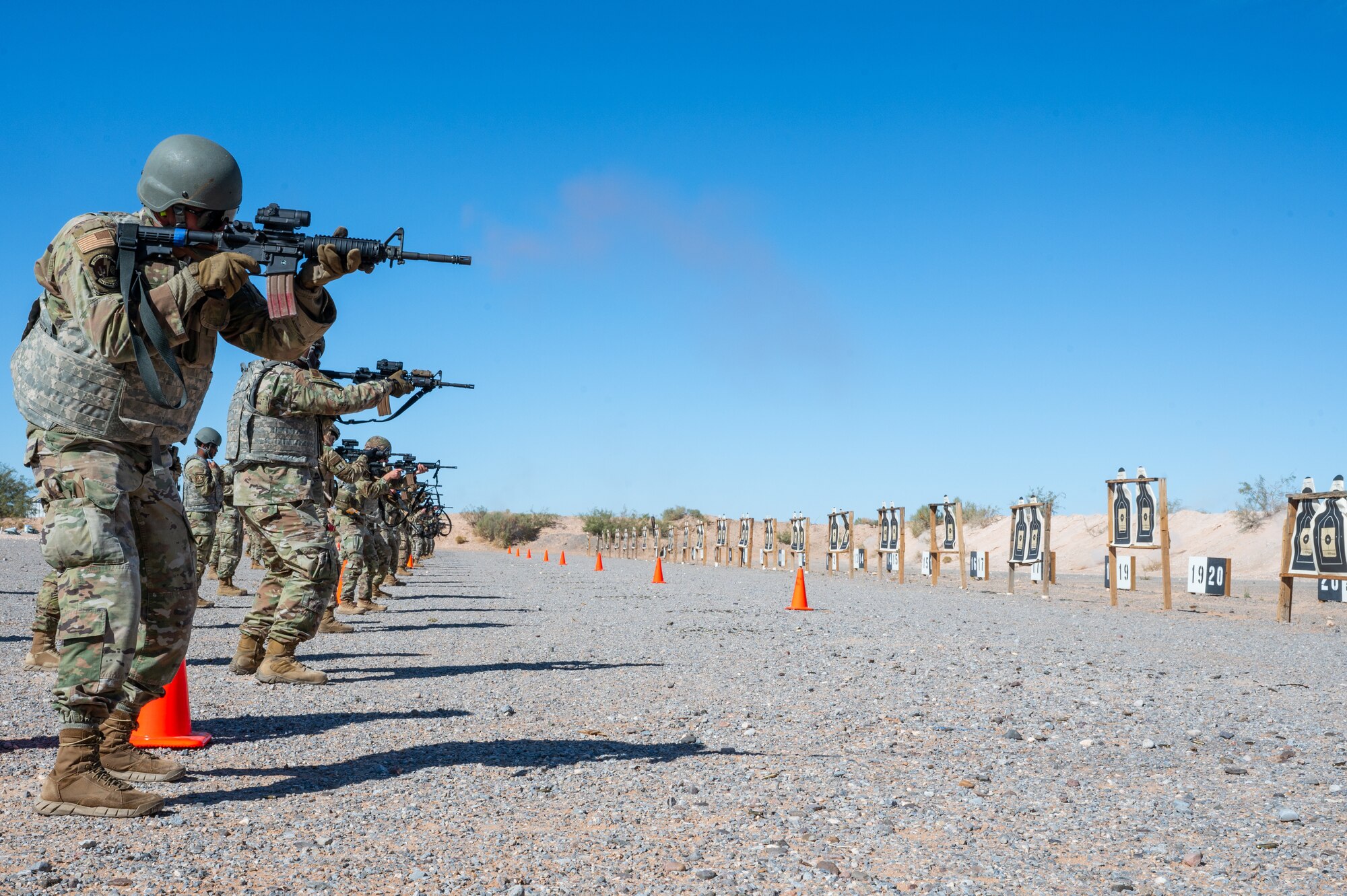 U.S. Airmen assigned to the 11th Air Task Force fire M4 carbines at McGregor Range, New Mexico, Nov. 12, 2024. Airmen of all experience levels applied firing tactics and safety techniques while increasing confidence firing a weapon. (U.S. Air Force photo by Airman 1st Class Jasmyne Bridgers-Matos)