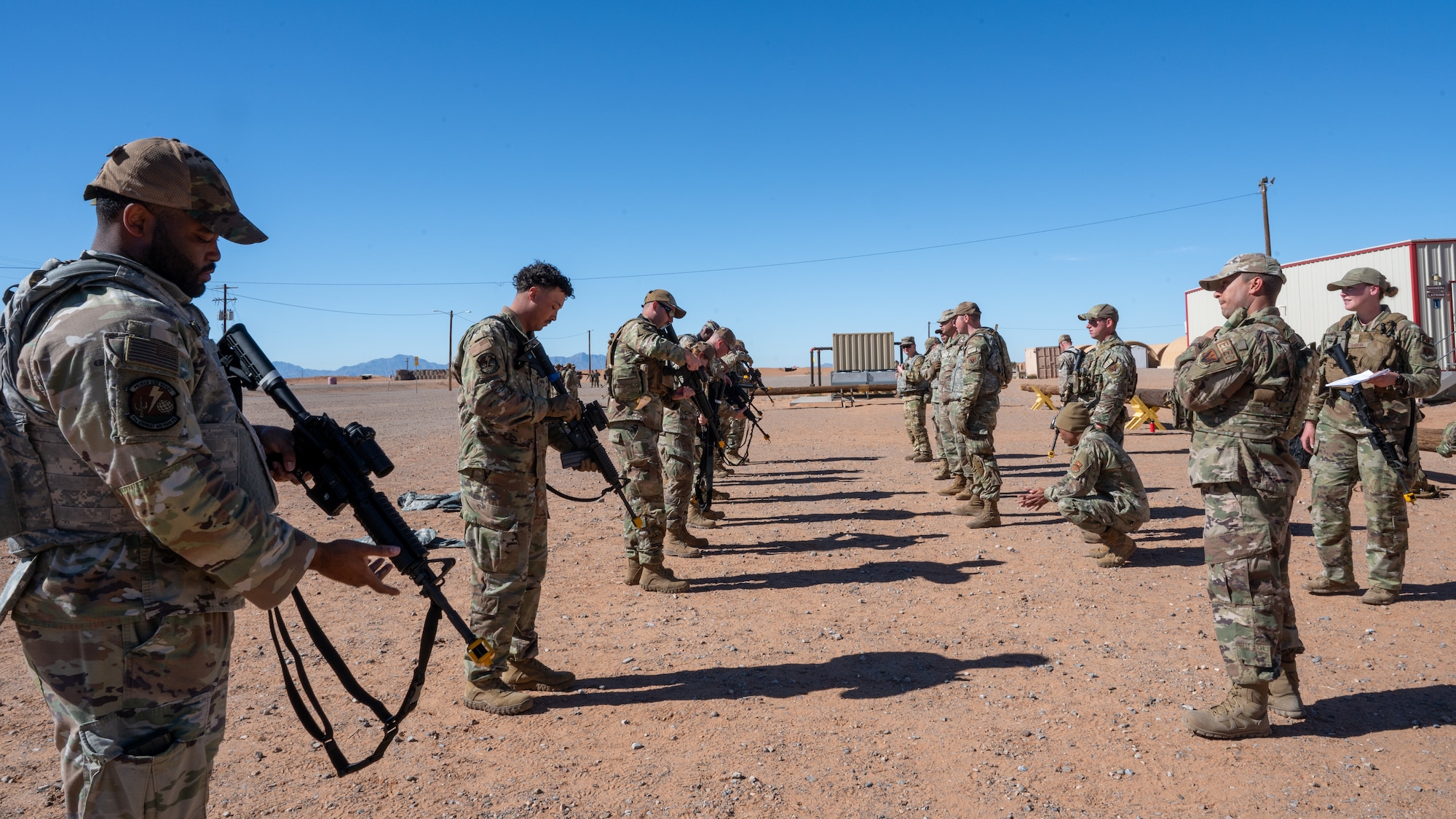 U.S. Air Force security forces Airmen assigned to the 11th Air Task Force conduct weapons familiarization and firing tactics training during the 11th ATF’s first field exercise at McGregor Range, New Mexico, Nov. 10, 2024. The training enabled Airmen of all experience levels to increase confidence and learn best practices before going to the firing range. (U.S. Air Force photo by Airman 1st Class Jasmyne Bridgers-Matos)