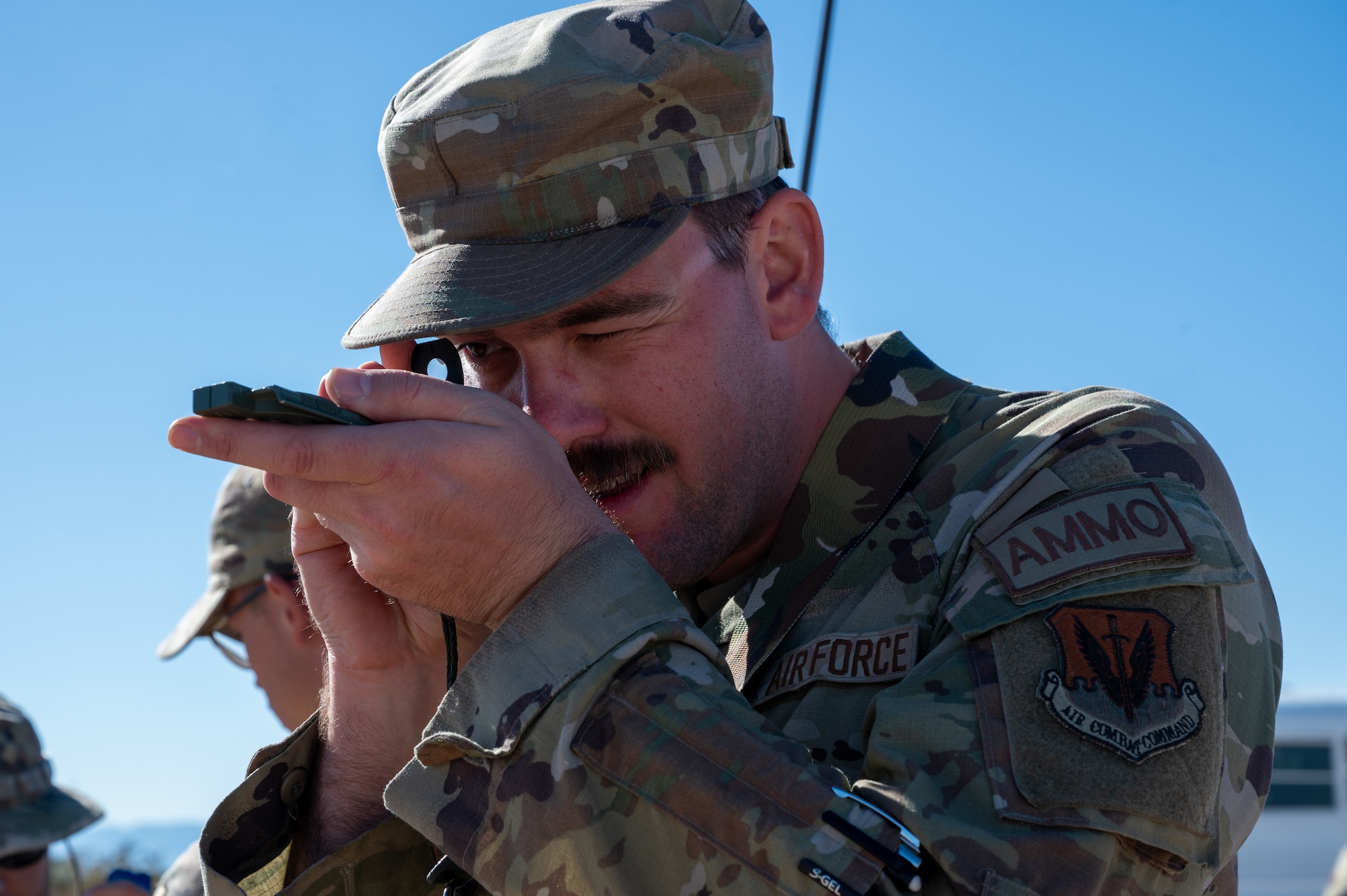 U.S. Air Force Staff Sgt. Justin Stoeckle, 355th Munitions Squadron conventional support super, uses a compass to find the location of the next landmark during the land navigation portion of the 11th Air Task Force’s first field exercise at McGregor Range, New Mexico, Nov. 8, 2024. Land navigation is a skill set that enables Airmen to survive and complete the mission under any circumstances. (U.S. Air Force photo by Airman 1st Class Jasmyne Bridgers-Matos)