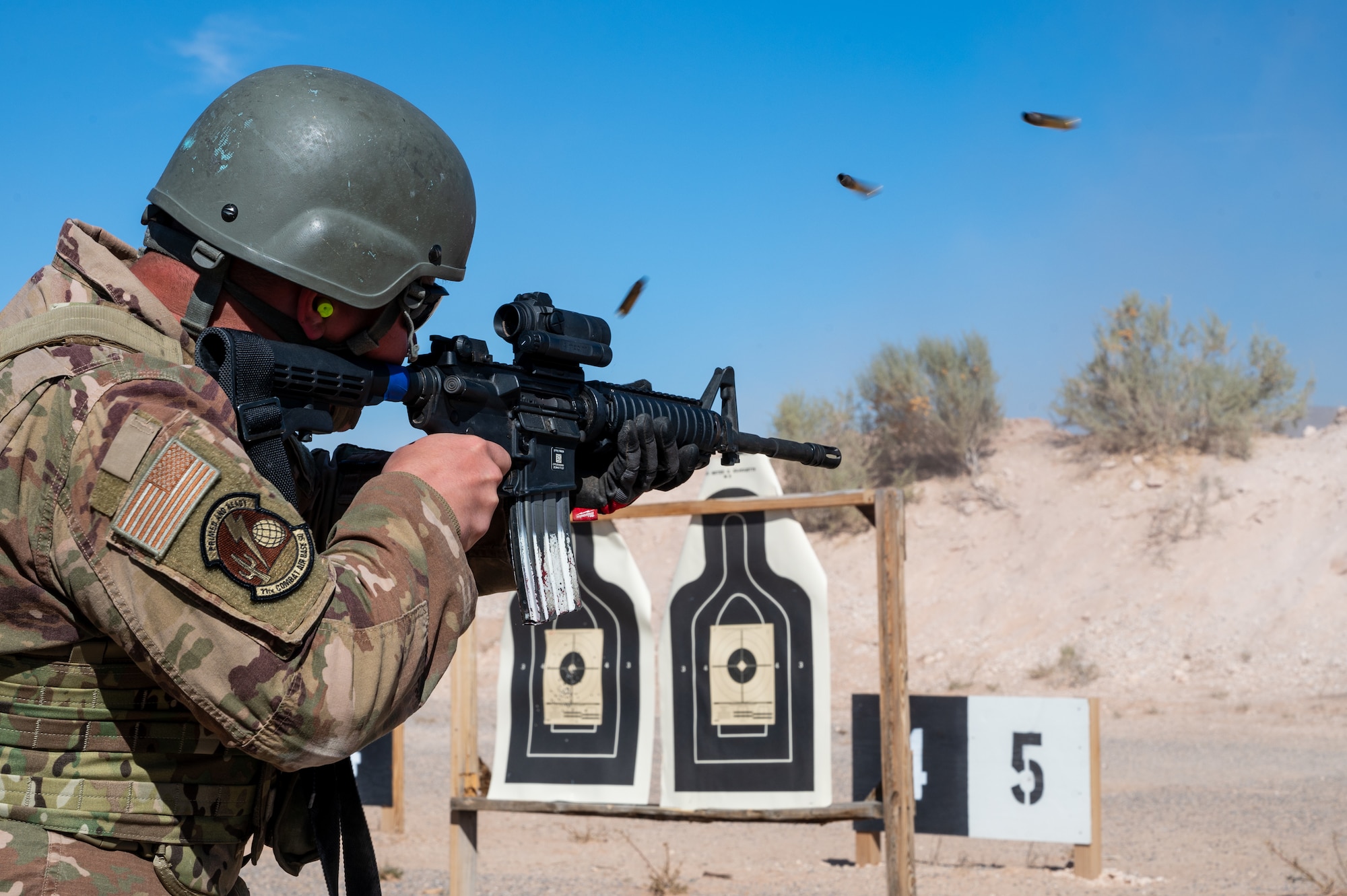 A U.S. Airman assigned to the 11th Air Task Force fires an M4 carbine at McGregor Range, New Mexico, Nov. 12, 2024. Airmen demonstrated proficiency using various shooting stances and techniques. (U.S. Air Force photo by Airman 1st Class Jasmyne Bridgers-Matos)