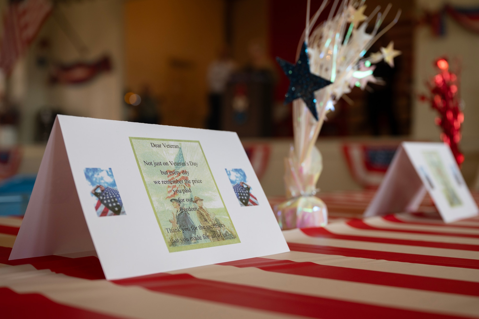 A card sits on a table at the annual Millersview Veterans Day celebration at Millersview, Texas, Nov. 11, 2024. Veterans Day honors the courage, sacrifice, and unwavering dedication of those who have served in the military, ensuring the freedoms and values that define the nation. (U.S. Air Force photo by Senior Airman Sarah Williams)