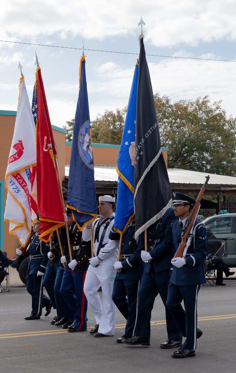 The Joint Service Color Guard presents the colors during the San Angelo Veterans Day parade downtown San Angelo, Texas, Nov. 9, 2024. Military members and veterans were honored throughout the parade. (U.S. Air Force photo by Staff Sgt. Nathan Call)