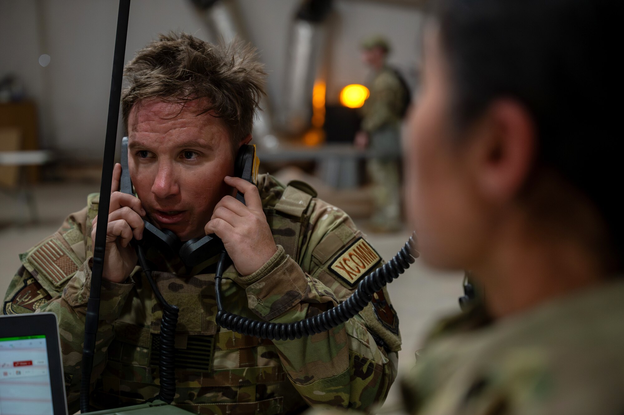 U.S. Air Force Staff Sgt. Sean Gilliland, 49th Communications Squadron noncommissioned officer in charge of radio, receives reports from various elements across the base during the 11th Air Task Force’s first field exercise at McGregor Range, New Mexico, Nov. 9, 2024. Information was channeled up from units in the field to the wing operations center, the central hub for situational awareness. (U.S. Air Force photo by Airman 1st Class Jasmyne Bridgers-Matos)