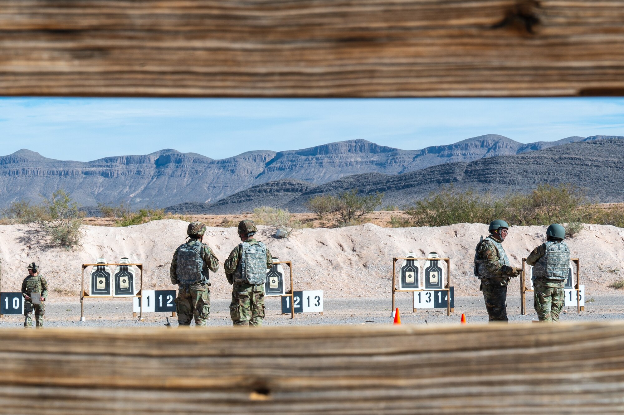 U.S. Airmen assigned to the 11th Air Task Force train on the firing range during the 11th ATF’s first field exercise at McGregor Range, New Mexico, Nov. 12, 2024. Airmen received training before applying newly acquired firing tactics and safety techniques while gaining experience firing a weapon. (U.S. Air Force photo by Airman 1st Class Jasmyne Bridgers-Matos)