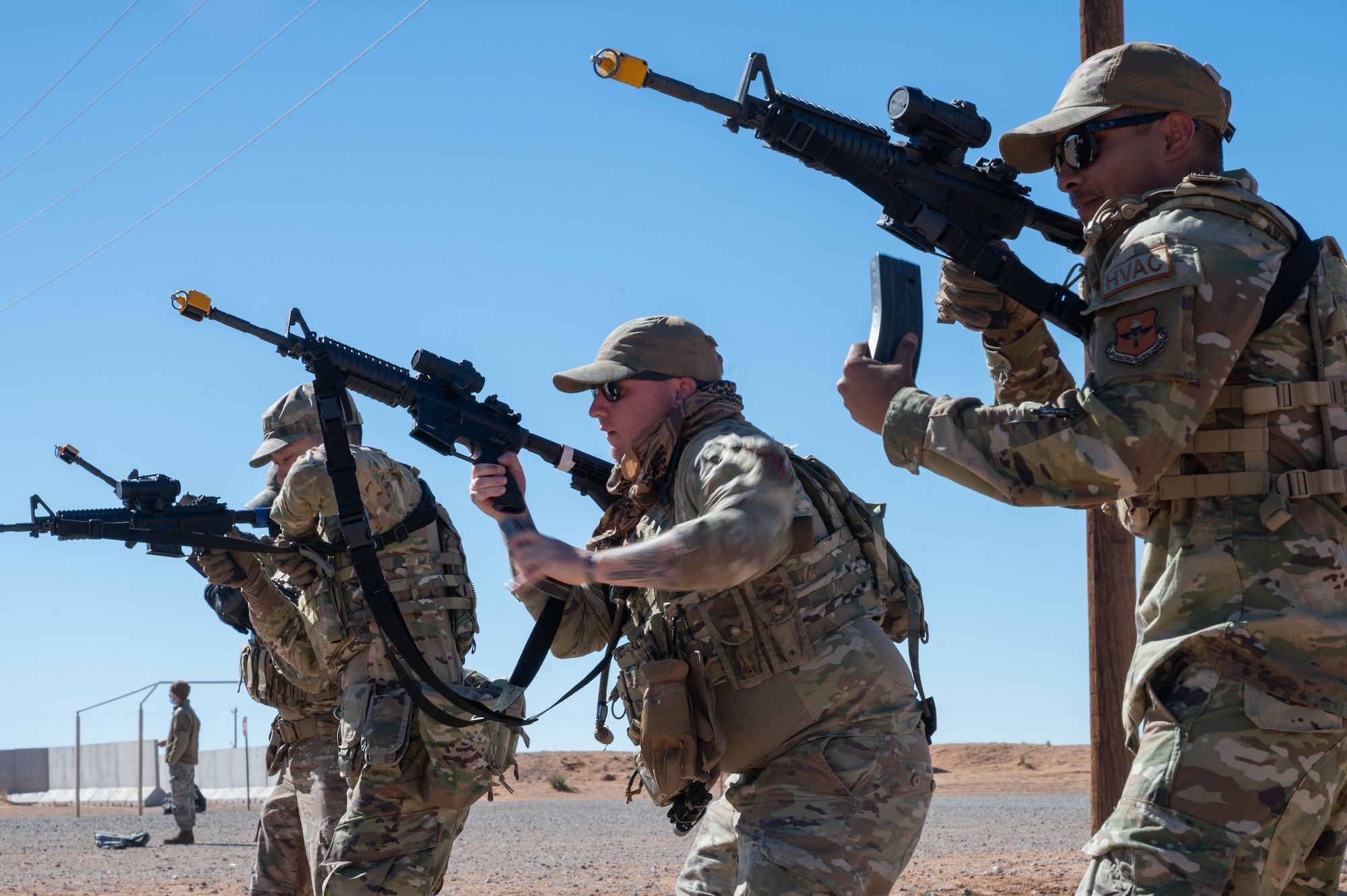U.S. Air Force Airmen assigned to the 11th Air Task Force perform a combat reload during the 11th ATF’s first field exercise at McGregor Range, New Mexico, Nov. 10, 2024. A combat reload is a quick way to reload a weapon by ejecting the current magazine and loading a new one in a short amount of time. (U.S. Air Force photo by Airman 1st Class Jasmyne Bridgers-Matos)