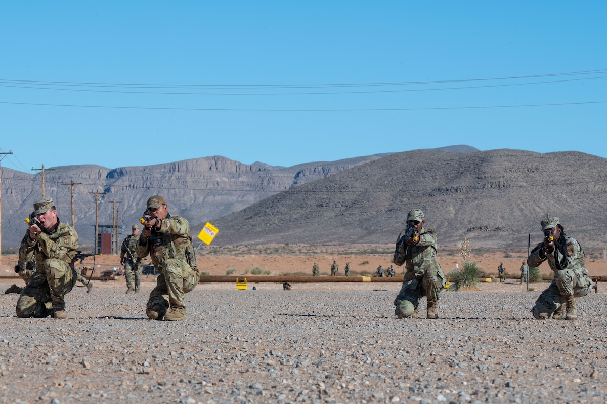 U.S. Airmen assigned to the 11th Air Task Force perform tactical movements during the 11th ATF’s first field exercise at McGregor Range, New Mexico, Nov. 10, 2024. Airmen split into pairs and took turns providing simulated cover fire so that the other pair could safely move into position. (U.S. Air Force photo by Airman 1st Class Jasmyne Bridgers-Matos