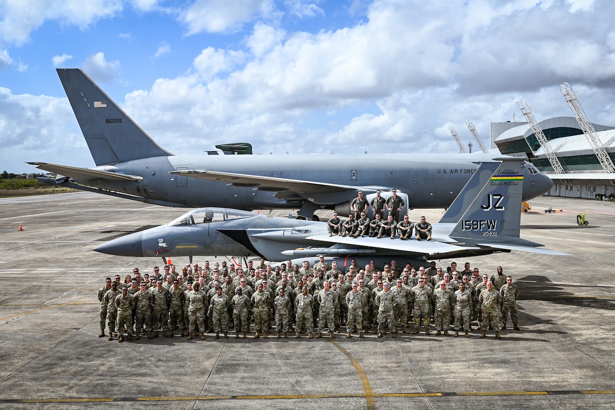 U.S. Air Force personnel supporting CRUZEX 2024 stand for a group photo at Natal Air Force Base, Brazil, Nov. 13, 2024. These joint exercises foster trust and cooperation, key elements in maintaining strong international partnerships. (U.S. Air Force photo by Staff Sgt. Madeline Herzog)