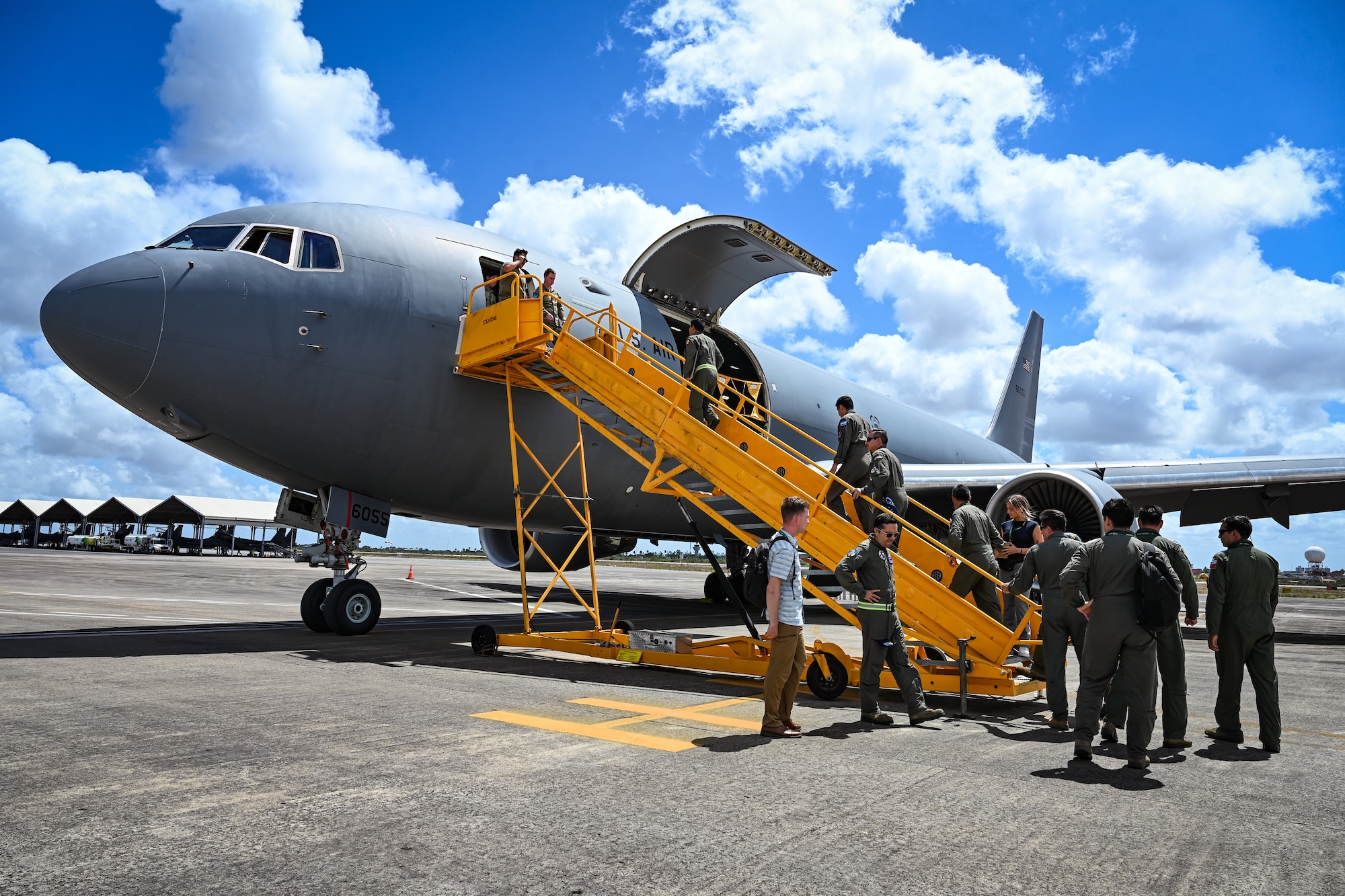 Militaries from Argentina, Brazil, Chile and Colombia board a U.S. Air Force KC-46A Pegasus assigned to the 305th Air Mobility Wing, Seymour Johnson Air Force Base, N.C., during CRUZEX 2024 for a static tour at Natal Air Force Base, Brazil, Nov. 14, 2024. The success of CRUZEX came at the heels of the United States celebrating its bicentennial diplomatic relations with Brazil. (U.S. Air Force photo by Staff Sgt. Madeline Herzog)