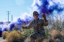 A U.S. Airman assigned to the 11th Air Task Force signals for his team to move forward during the first 11th ATF field exercise at McGregor Range, New Mexico, Nov. 8, 2024. Airmen used visual signals to communicate with their team while in a simulated contested environment. (U.S. Air Force photo by Airman 1st Class Jasmyne Bridgers-Matos)