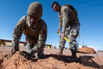 U.S. Airmen assigned to the 11th Air Task Force construct a defensive fighting position during the 11th ATF’s first field exercise at McGregor Range, New Mexico, Nov. 10, 2024. Security forces Airmen taught wingmen how to dig and create a location in the ground from which to provide cover. (U.S. Air Force photo by Airman 1st Class Jasmyne Bridgers-Matos)