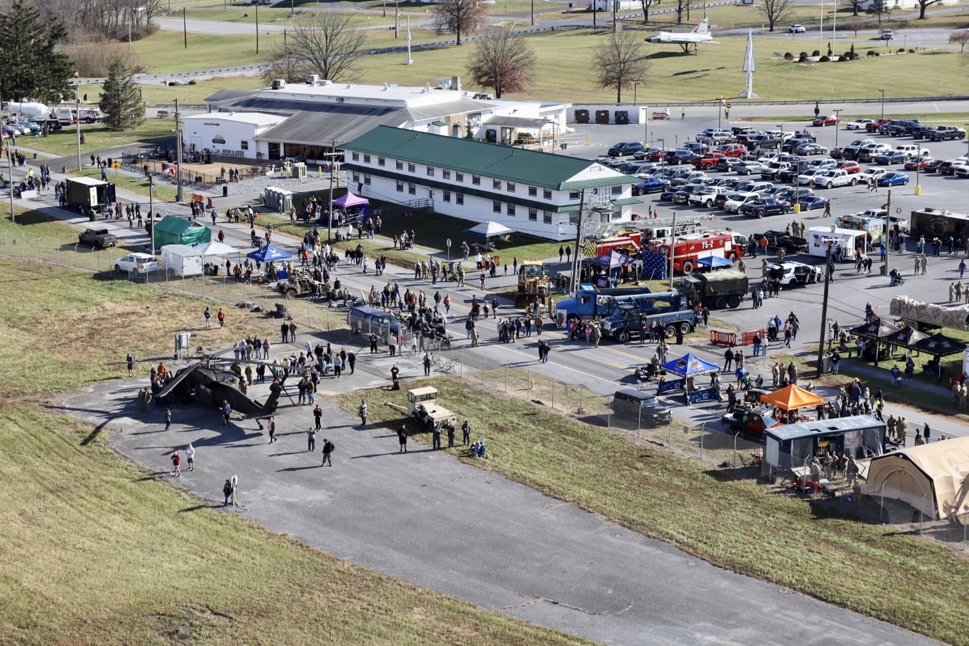 U.S. Soldiers and Airmen with the Pennsylvania National Guard engage with members of the local community during an open house at Fort Indiantown Gap, Pennsylvania, Nov. 16, 2024. This free event featured Miss Pennsylvania, live tactical demonstrations, flyovers, displays of military equipment and vehicles, food trucks, live music and a performance by the Pennsylvania National Guard’s Ambassador Demonstration Team. (U.S. Army National Guard photo by Cadet Jessica Barb)