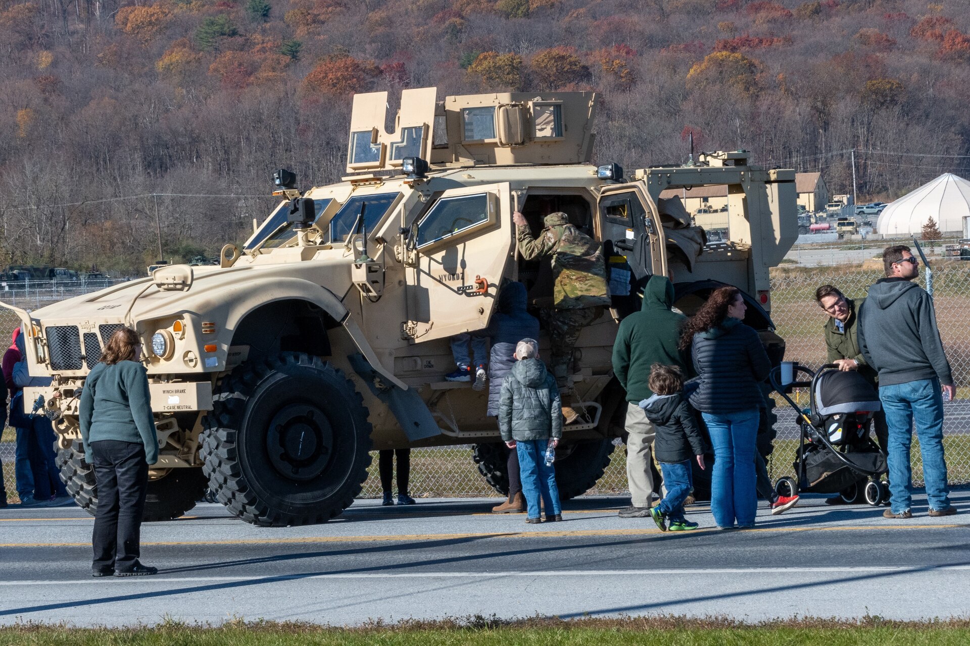 U.S. Soldiers and Airmen with the Pennsylvania National Guard engage with members of the local community during an open house at Fort Indiantown Gap, Pennsylvania, Nov. 16, 2024. This free event featured Miss Pennsylvania, live tactical demonstrations, flyovers, displays of military equipment and vehicles, food trucks, live music and a performance by the Pennsylvania National Guard’s Ambassador Demonstration Team. (U.S. Army National Guard photo by Wayne V. Hall)