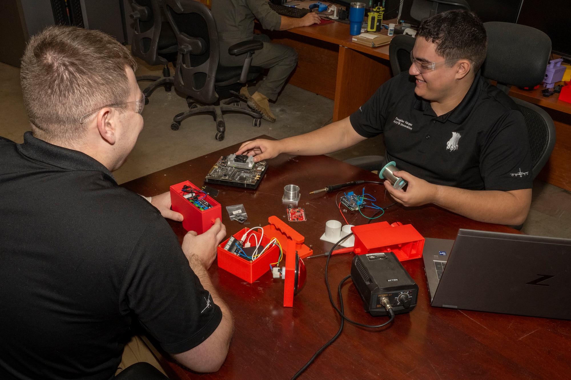 Staff Sgt. Hunter Diedrich, 22nd Air Refueling Wing Innovation Lab noncommissioned officer in charge, and Senior Airman Douglas Vargas, 22nd ARW Innovation Lab intern, work on the KC-46A Pegasus Auxiliary Power Unit Start System (APRUSS) at McConnell Air Force Base, Kansas, Nov. 14, 2024. This year, the lab was awarded $250,000 by the Defense Innovation Unit to continue research and development of the APRUSS. (U.S. Air Force photo by Airman 1st Class Paula Arce)