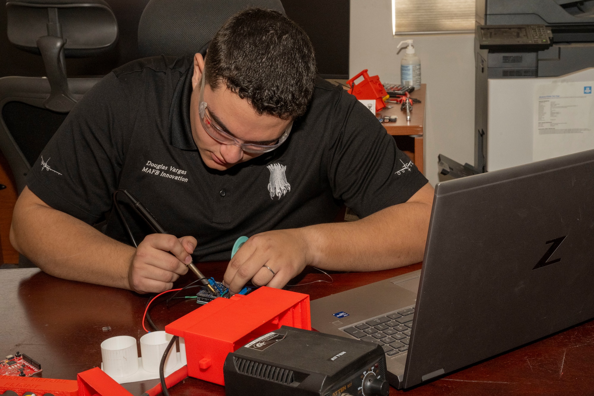 Senior Airman Douglas Vargas, 22nd Air Refueling Wing Innovation Lab intern, works on the KC-46A Pegasus Auxiliary Power Unit Start System (APRUSS) at McConnell Air Force Base, Kansas, Nov. 14, 2024. Vargas originally had a three-month-long internship at the Innovation Lab, however, was able to secure an extension from the 22nd Maintenance Squadron to stay until the end of 2024. (U.S. Air Force photo by Airman 1st Class Paula Arce)