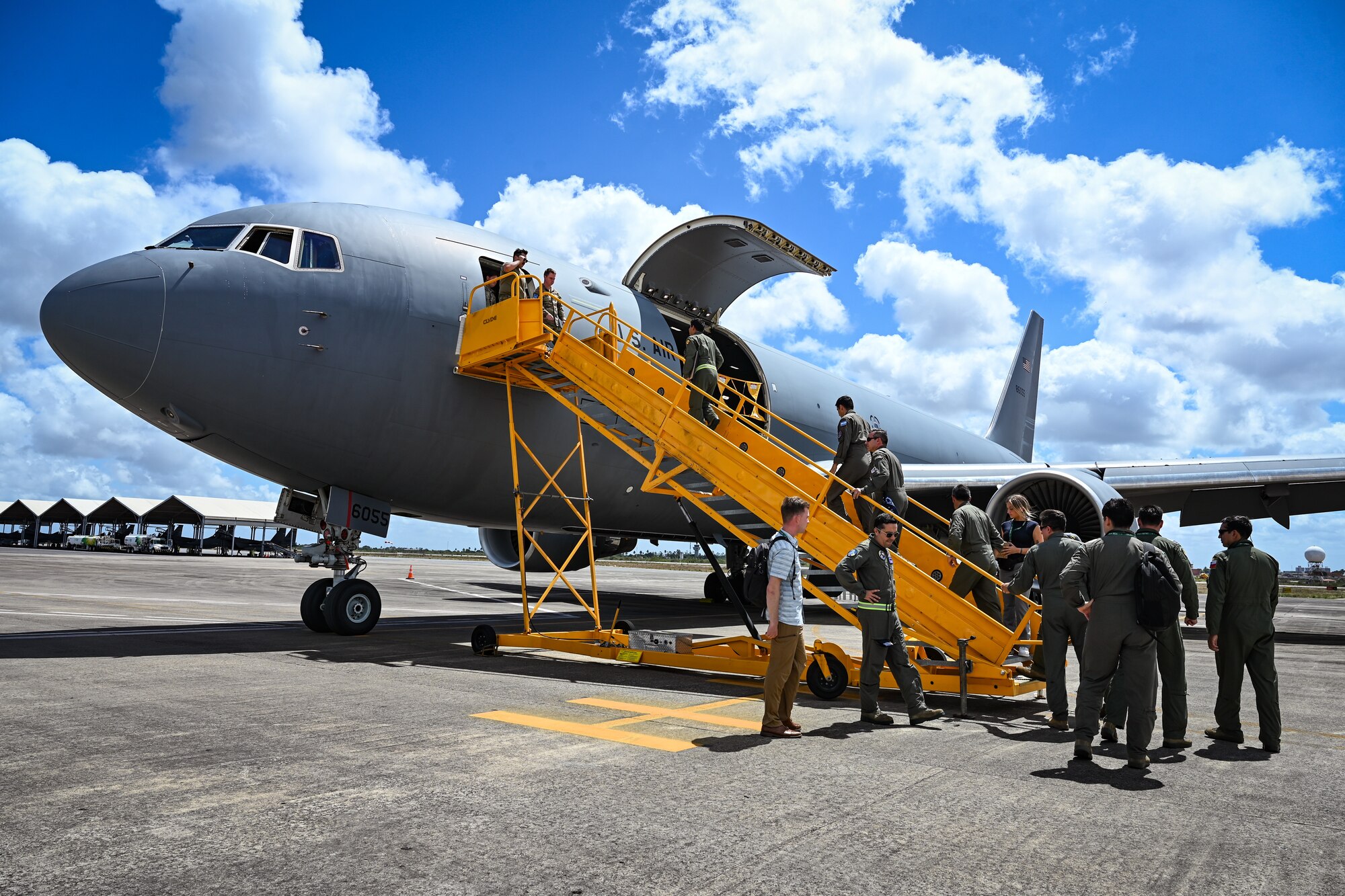 Militaries from Argentina, Brazil, Chile and Colombia board a U.S. Air Force KC-46A Pegasus assigned to the 305th Air Mobility Wing, Seymour Johnson Air Force Base, N.C., during CRUZEX 2024 for a static tour at Natal Air Force Base, Brazil, Nov. 14, 2024. The success of CRUZEX came at the heels of the United States celebrating its bicentennial diplomatic relations with Brazil. (U.S. Air Force photo by Staff Sgt. Madeline Herzog)