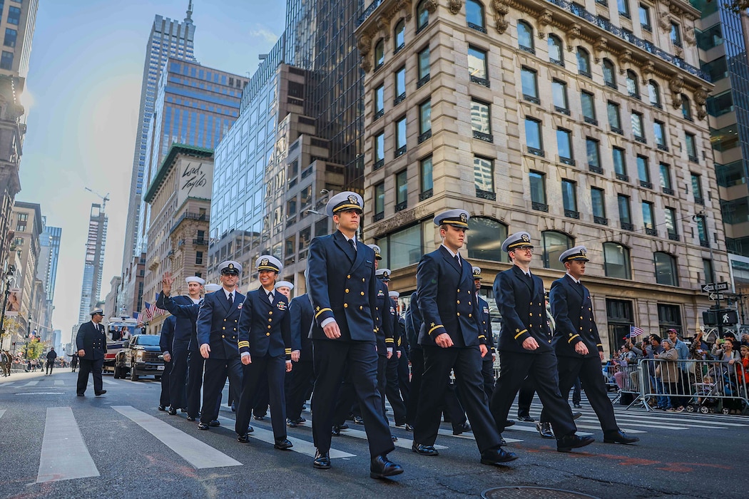 Sailors from the Arleigh Burke-class guided-missile destroyer USS John Basilone (DDG 122) participate in the New York City Veterans Day Parade Nov. 11, 2024. The Sailors joined other military units, marching bands, and veterans’ organizations in honoring the service and sacrifices of America’s veterans throughout a week of commemorative events in New York City. (U.S. Navy photo by Navy Petty Officer 2nd Class Theoplis Stewart II)