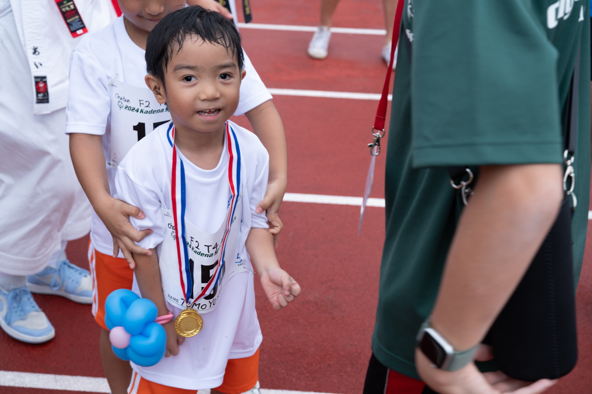 Kadena Special Olympic participant is being given a gold medal