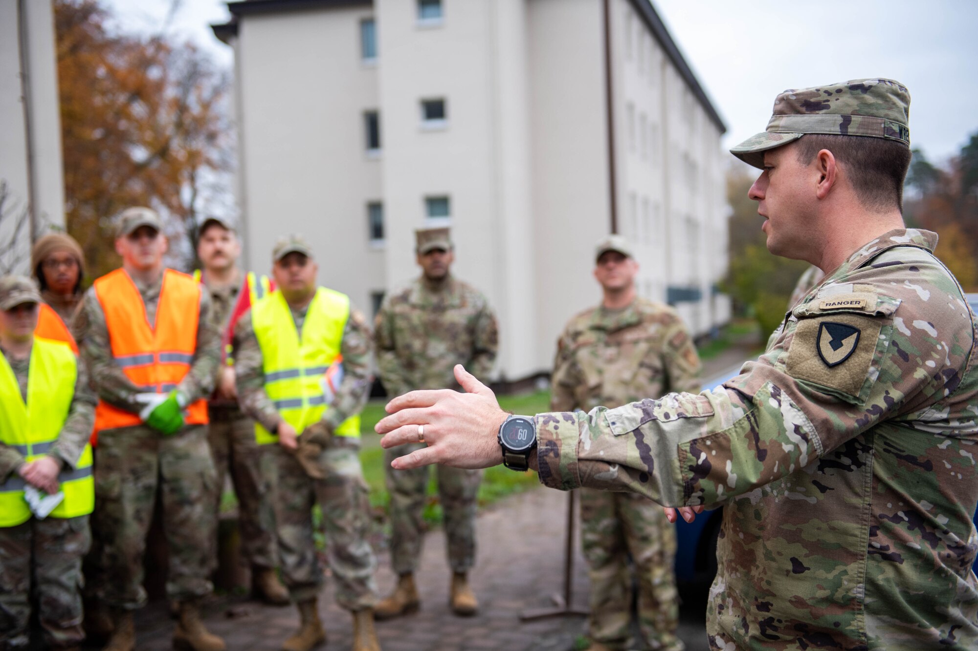 Command Sgt. Maj. speaks to a group of volunteers before group clean up.