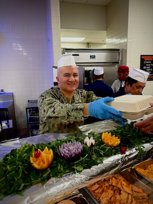 SAN DIEGO (Nov. 19, 2024) Naval Medical Center San Diego (NMCSD) celebrated the holiday season with its annual Thanksgiving Special Meal, bringing together staff, patients, and their families for a festive occasion, Nov. 19, 2024.  Held in the medical facility’s galley, the event showcased an extensive menu of traditional Thanksgiving dishes prepared by the command’s galley staff.  Lt. Cmdr. Jason Asencio, Department Head for NMCSD Food Services and a native of Long Island, N.Y., shared his thoughts on the importance of the event as he serves meals, saying, "Thanksgiving is a time for gratitude, and today’s meal is our way of saying thank you to everyone who contributes to the mission of NMCSD. Whether you're in uniform or receiving care, this meal is about coming together as a family."  NMCSD’s mission is to prepare service members to deploy in support of operational forces, deliver high-quality health care services, and advance military medicine through education, training, and research. The center employs more than 5,000 active-duty personnel, civilians, and contractors across Southern California, delivering world-class patient care to service members, veterans, and their families.