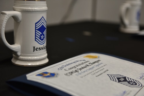 A certificate and mug lie on a table at the Chief Release Party at the Powell Event Center, Goodfellow Air Force Base, Texas, Nov. 18, 2024. Wing leadership later presented the mugs and certificates to the 17th Training Wing chief master sergeant selects. (U.S. Air Force photo by 1st Lt. Harris Hillstead)