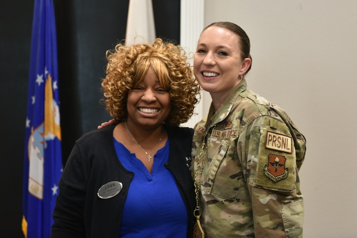 U.S. Air Force Chief Master Sgt. Select Jessica Thompson, 17th Force Support Squadron senior enlisted leader, and Jacquanna Whitfield, Child and Youth Services flight chief, stand for a photo during the Chief Release Party at the Powell Event Center, Goodfellow Air Force Base, Texas, Nov. 18, 2024. Whitfield congratulated Thompson on her selection for promotion. (U.S. Air Force photo by 1st Lt. Harris Hillstead)