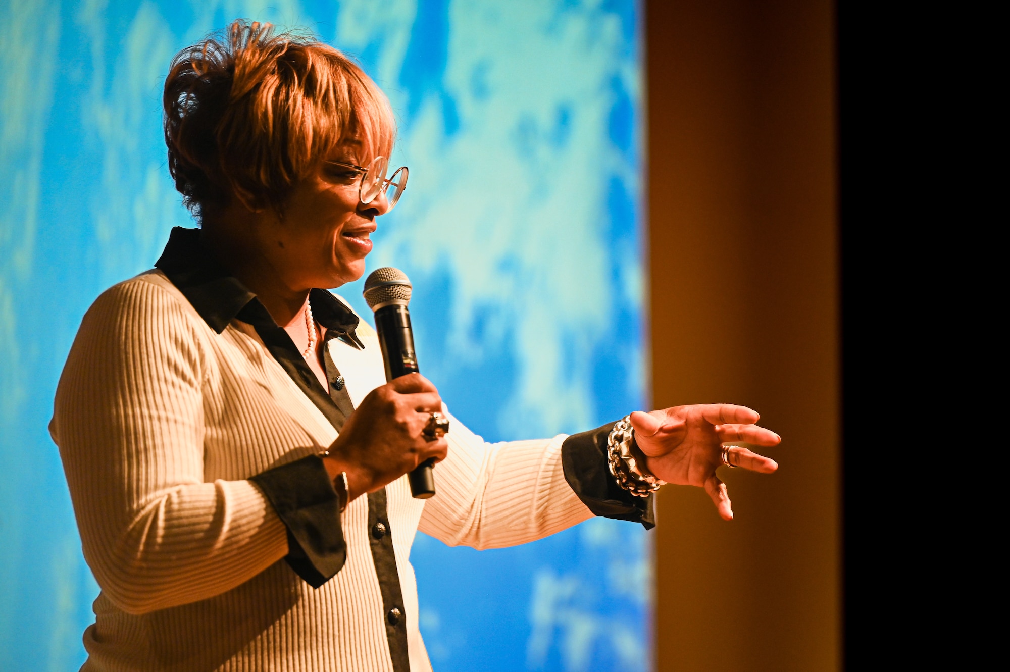 woman delivers speech on stage