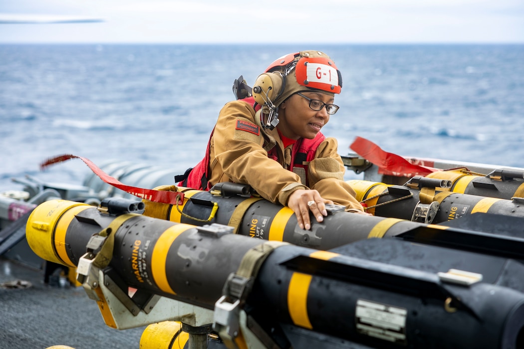 Chief Aviation Ordnanceman Cherelle Hendricks, a native of Culver, Delaware, transports ordnance on the flight deck of the Nimitz-class aircraft carrier USS Harry S. Truman (CVN 75), Nov. 19.