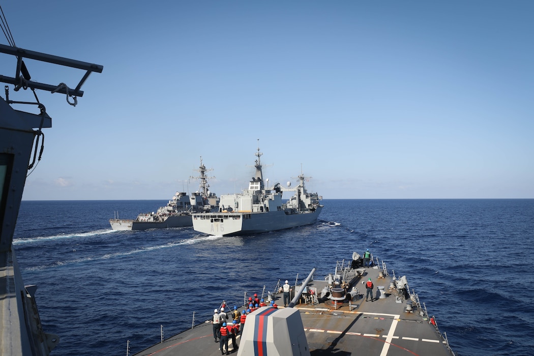 The Arleigh Burke-class guided-missile destroyer USS Jason Dunham (DDG 109) prepares for a replenishment-at-sea with the Spanish navy replenishment oiler ESPS Cantabria (A 15) in the Mediterranean Sea.