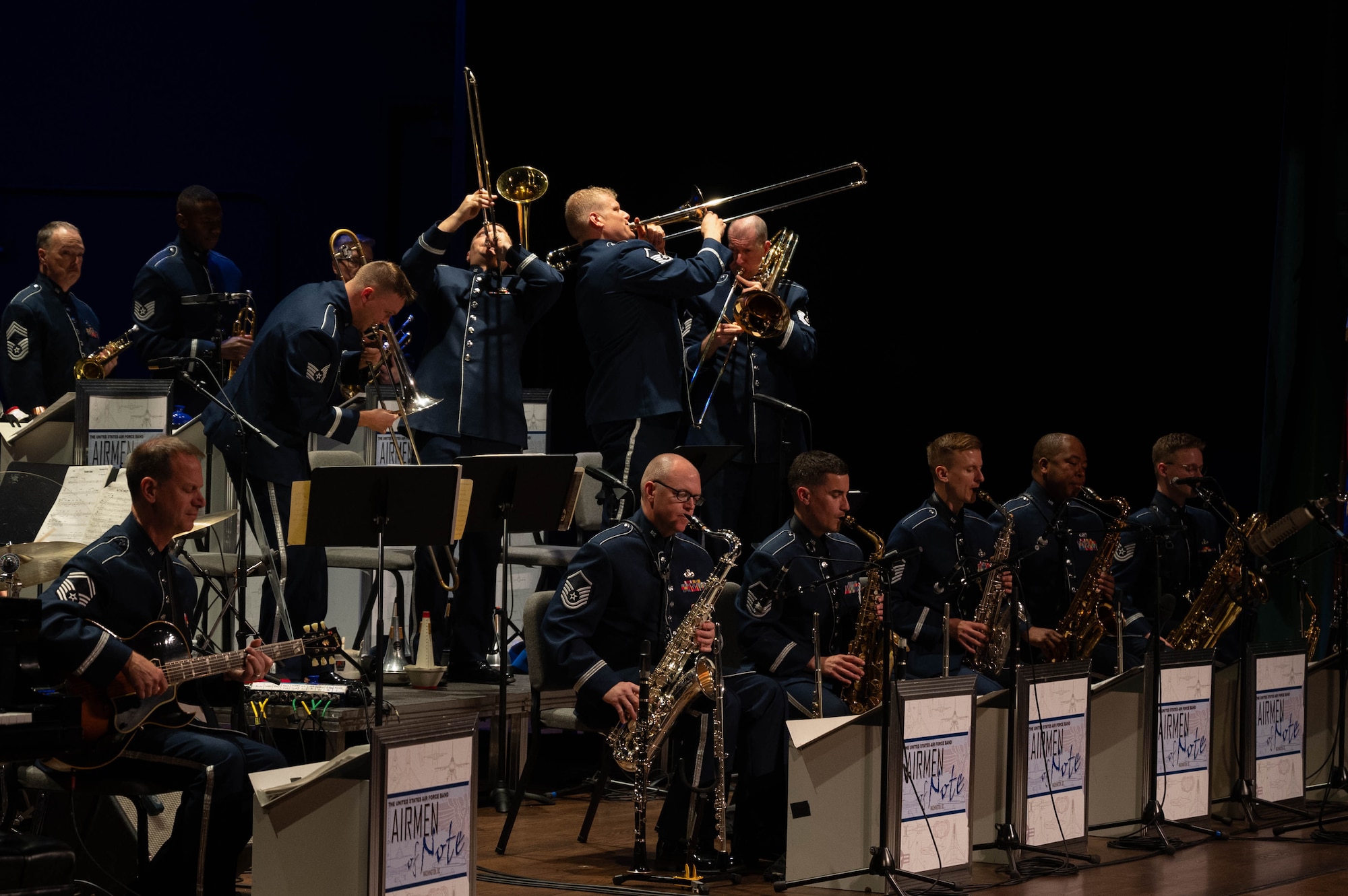 The trombone section of the Airmen of Note performs choreography for a rendition of Glenn Miller’s “In the Mood” during a performance in the Airmen of Note Fall 2024 tour at the State College of Florida Bradenton Campus in Bradenton, Fla., Nov. 12, 2024. The Airmen of Note’s mission, as a part of the U.S. Air Force Band, is to honor those who have served, inspire American citizens to heighten patriotism and service, and to connect the global community on behalf of the U.S. Air Force and the United States. The Airmen of Note consists of 17 active duty musicians and one vocalist stationed at Joint Base Anacostia-Bolling, Washington, D.C. (U.S. Air Force photo by Hayden Hallman)