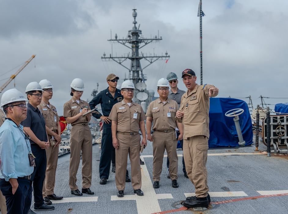 USS Daniel Inouye (DDG 118) Commanding Officer Cmdr. Kevin Dore leads a tour for Republic of Korea (ROK) officers during a ship visit by the ROK.