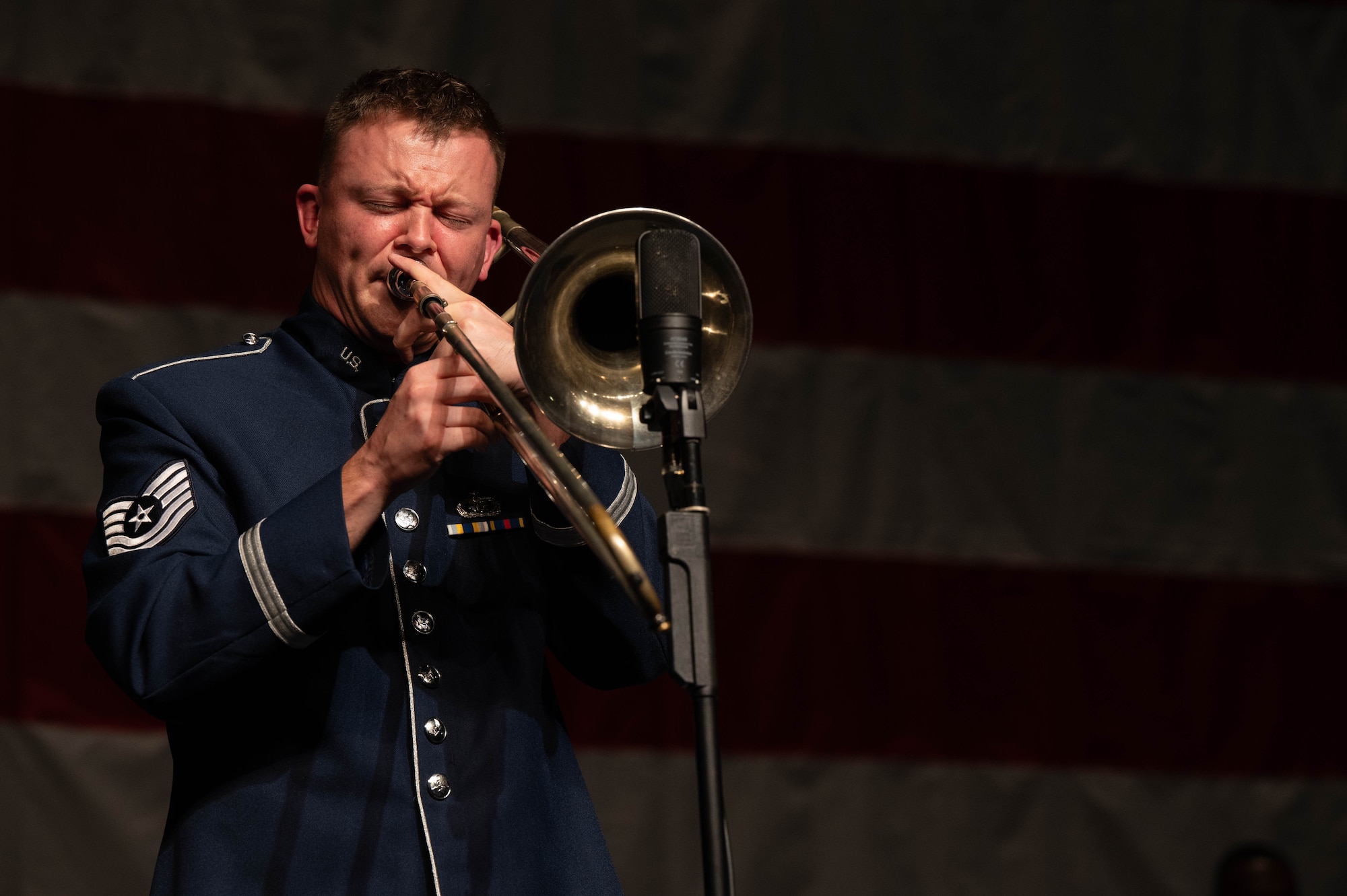 U.S. Air Force Tech. Sgt. Brendan Lanighan, trombonist with the USAF Band, performs a trombone solo during an event in the Airmen of Note Fall 2024 tour in Punta Gorda, Fla., Nov. 13, 2024. The Airmen of Note’s mission, as a part of the U.S. Air Force Band, is to honor those who have served, inspire American citizens to heighten patriotism and service, and to connect the global community on behalf of the U.S. Air Force and the United States. The Airmen of Note consists of 17 active duty musicians and one vocalist stationed at Joint Base Anacostia-Bolling, Washington, D.C. (U.S. Air Force photo by Hayden Hallman)