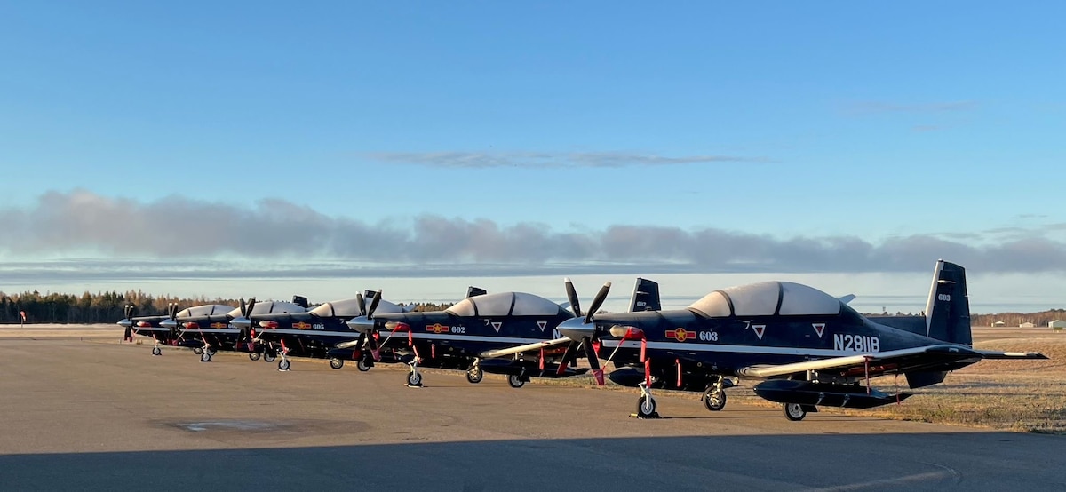 T-6C Aircraft are parked on a flightline in Canada as they make their way to Vietnam. The delivery of the initial T-6 C aircraft signifies a milestone for the U.S. Air Force and the Vietnam ADAF, with the full complement of 12 T-6C aircraft scheduled for delivery by 2025.