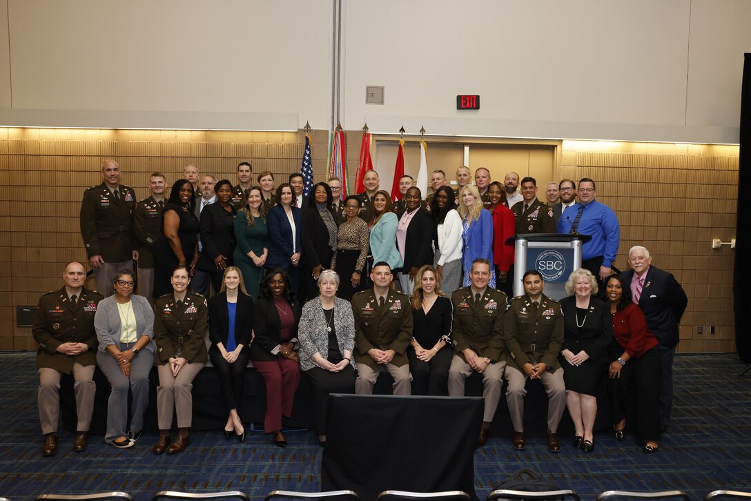 Group photo of several people who received awards.