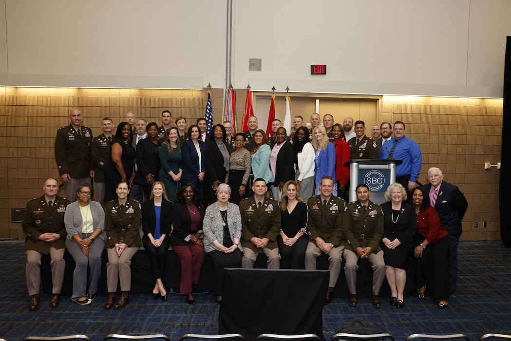 Group photo of several people who received awards.