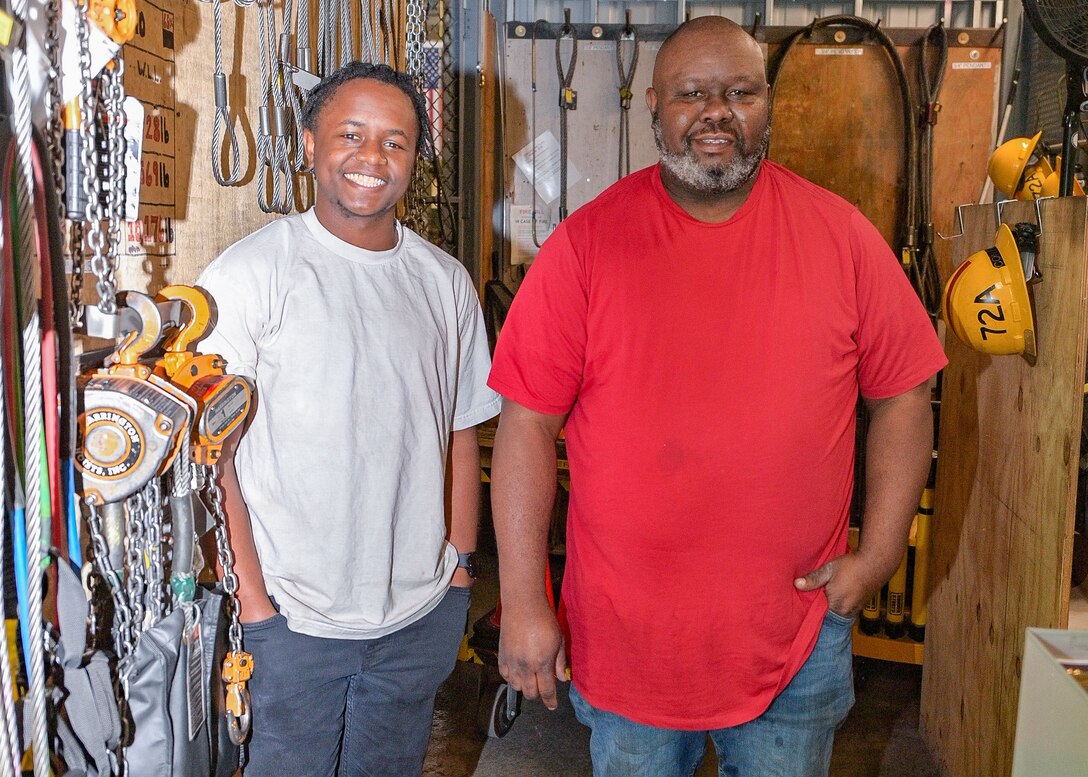 Craig Randle Sr. (right) and Craig Randle Jr. (left) stand inside the rigging shop at TRFB.