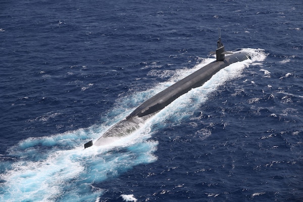 A submarine sails on the surface of the ocean.