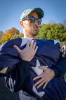 Nick Grim, marketing and communications specialist, Code 1182, Workforce Development, participates in a flag-folding ceremony Nov. 7, during a special Veterans Day observance at Puget Sound Naval Shipyard & Intermediate Maintenance Facility in Bremerton, Washington. (U.S. Navy photo by Wendy Hallmark)