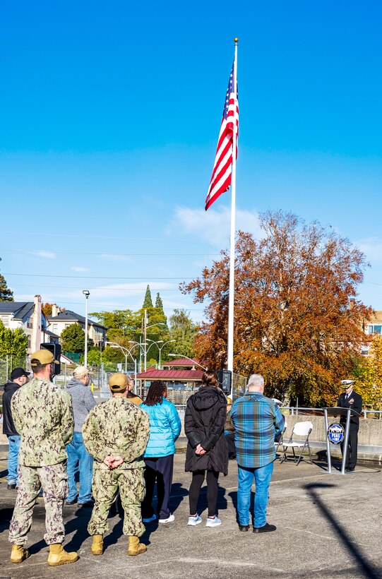 Capt. JD Crinklaw, commander, PSNS & IMF, delivers an address Nov. 7, 2024, during a special Veterans Day flag-folding ceremony at Puget Sound Naval Shipyard & Intermediate Maintenance Facility in Bremerton, Washington. (U.S. Navy photo by Wendy Hallmark)