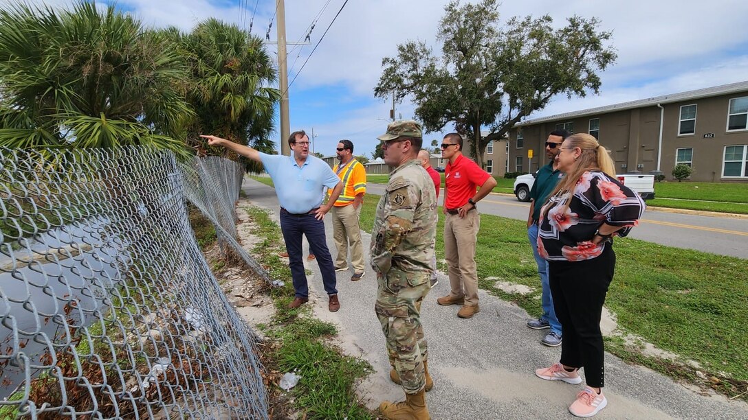 At the corner of Jean St. and South St. in the City of Daytona Beach, USACE Jacksonville District Project Manager, Jim LaGrone explains to Jacksonville district leadership, and Volusia County officials the existing stormwater canal system at the location where two different drainage canals connect. The Daytona Beach FRM study is located at the southern end of Midtown of the City of Daytona Beach and is home to 8,000 people living in that area that is prone to flooding during major storms due to the low-lying, bowl shape topography.