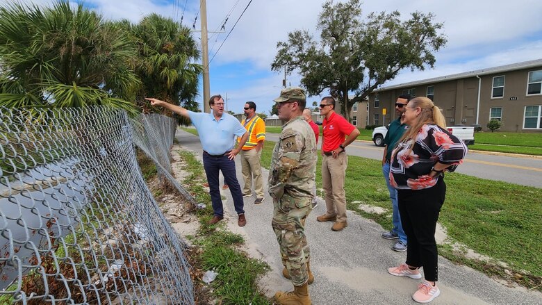 At the corner of Jean St. and South St. in the City of Daytona Beach, USACE Jacksonville District Project Manager, Jim LaGrone explains to Jacksonville district leadership, and Volusia County officials the existing stormwater canal system at the location where two different drainage canals connect. The Daytona Beach FRM study is located at the southern end of Midtown of the City of Daytona Beach and is home to 8,000 people living in that area that is prone to flooding during major storms due to the low-lying, bowl shape topography.