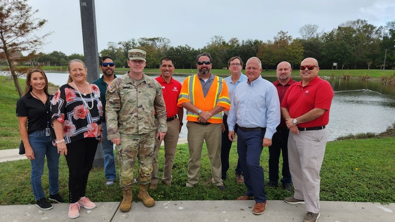USACE Jacksonville District Commander Col. Brandon Bowman and Deputy Engineer, Mr. Howie Gonzalez pose for a group photo with City of Daytona Beach and Volusia County officials at Samuel Butts Archeological Park to discuss the recent Hurricane Milton flooding that occurred within the Daytona Beach Flood Risk Management Study (FRM).  The Daytona Beach FRM study’s aim is to investigate, analyze and propose alternative mitigation responses to chronic flooding within the study area.