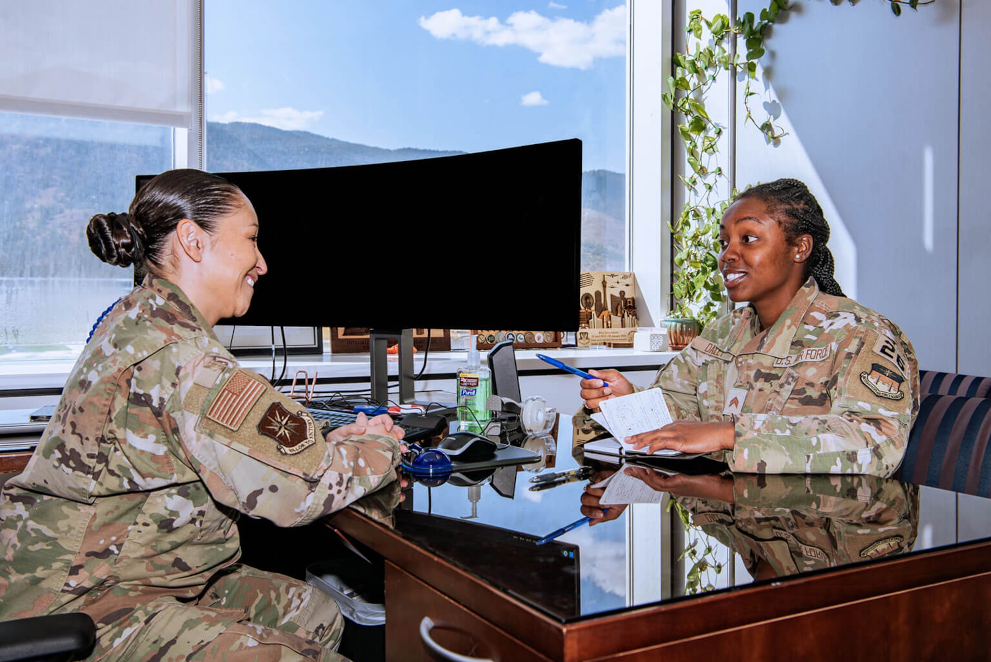 U.S. Air Force Academy Cadet 2nd Class Te’Anne Dailey, right, discusses her future with U.S. Air Force Senior Master Sgt. Erica Salarda Oct. 10, 2024. Salarda is the Cadet Wing Integration, Innovation and Development senior enlisted advisor. Dailey, a prior-enlisted security forces specialist, took advantage of the Leaders Encouraging Airman Development Program to secure an Academy appointment. (U.S. Air Force photo by Dylan Smith)