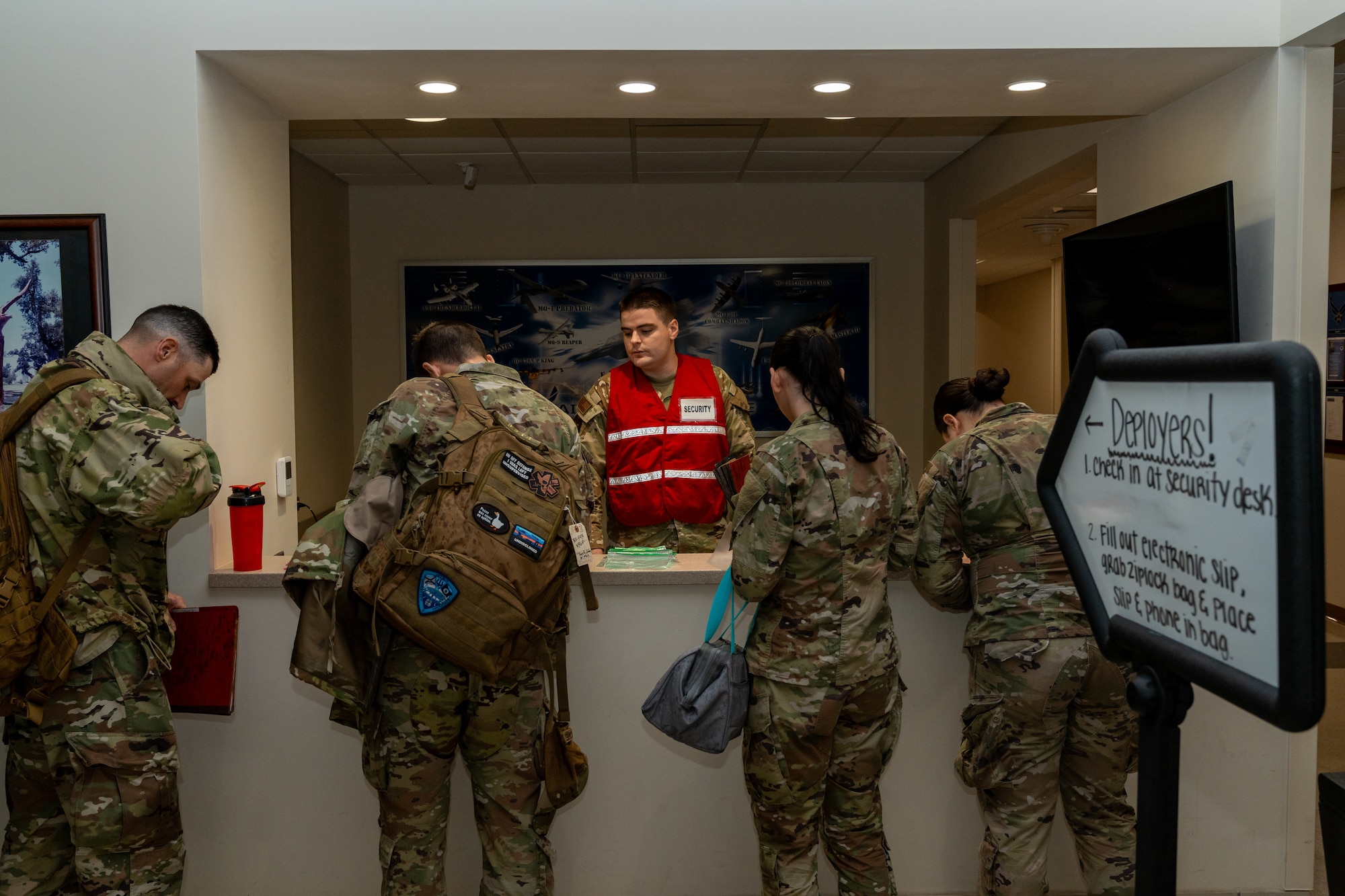 U.S. Air Force 2nd Lt. Paul James, 333rd Training Squadron student, checks in airmen assigned to the 81st Training Wing during the Combat Readiness Inspection at Keesler Air Force Base, Mississippi, Nov. 19, 2024.